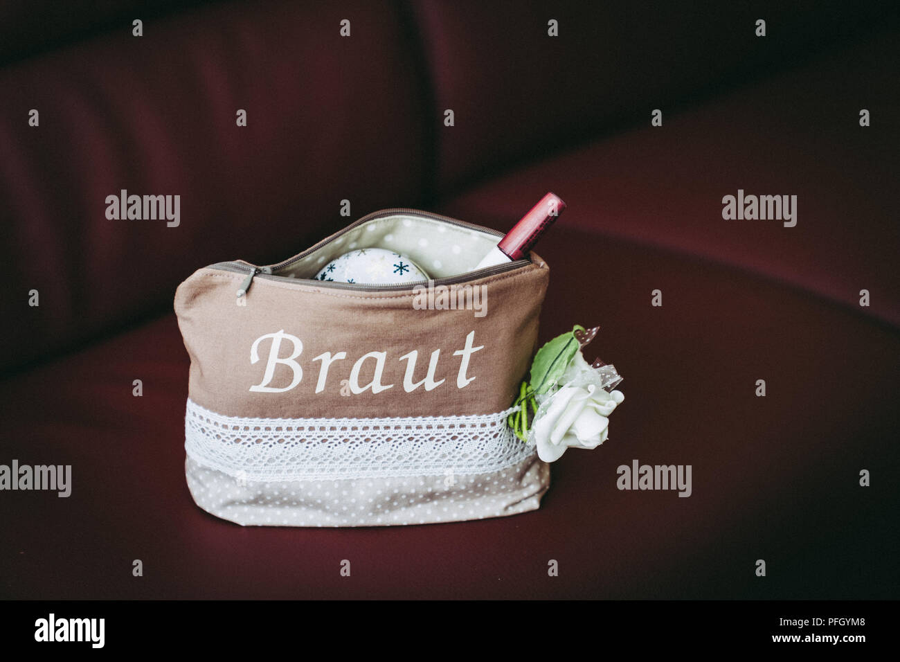 Cosmetic bag on the leather couch Stock Photo