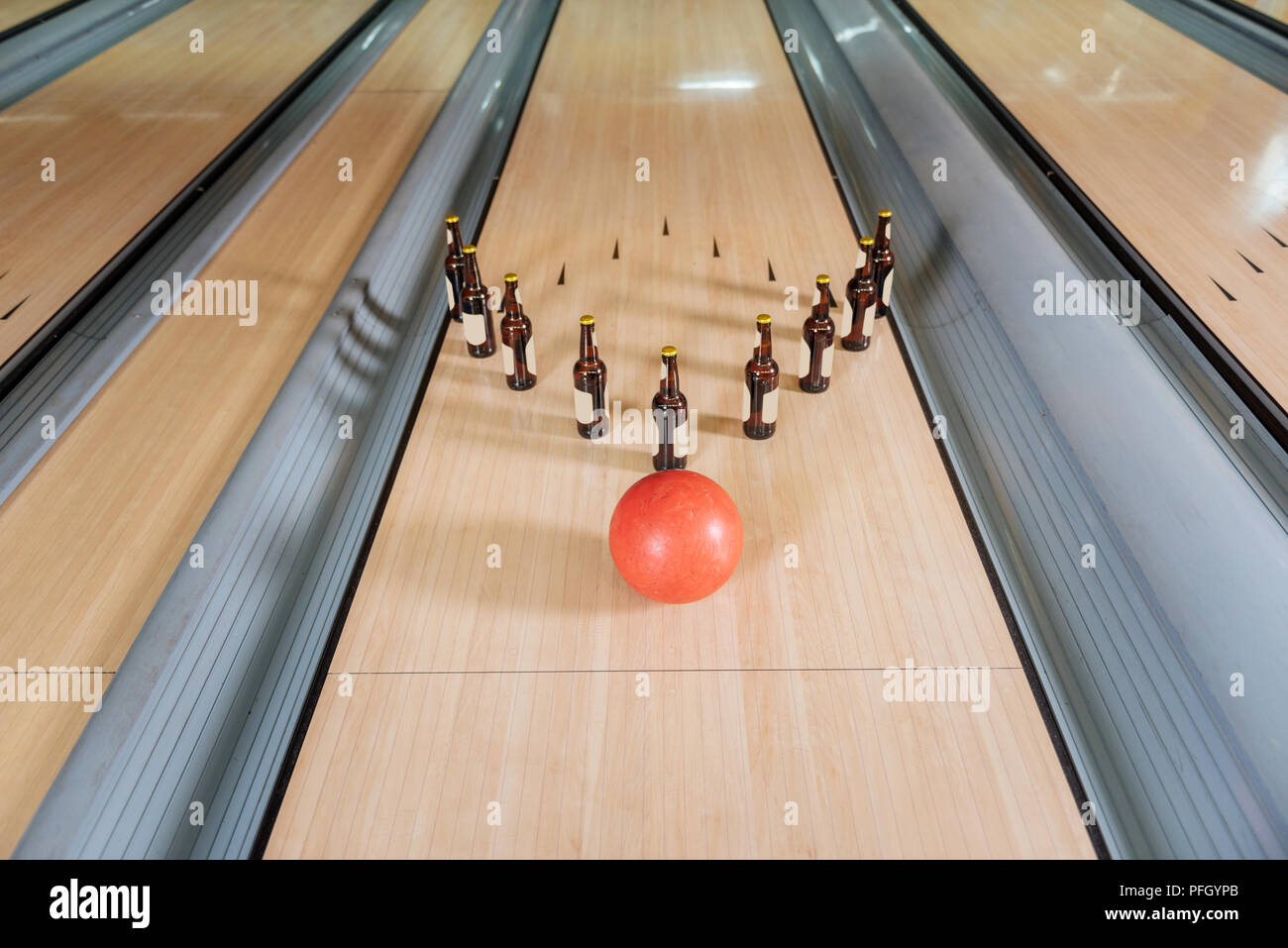 Top view of a bowling ball hitting bottles Stock Photo Alamy