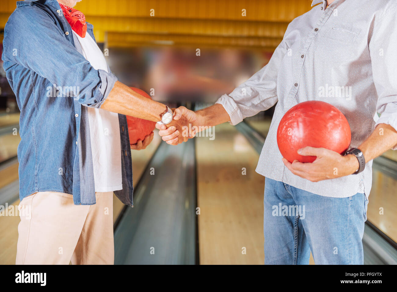 Close up of a handshake in a bowling club Stock Photo