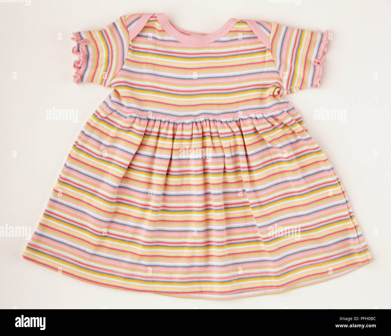 Multicoloured stripey dress. Stock Photo