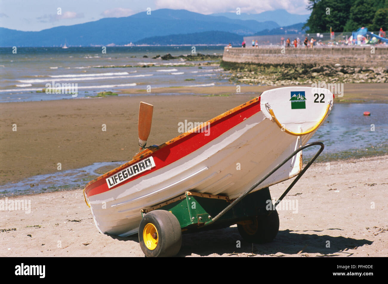 Canada, Pacific Northwest, British Columbia, Vancouver, Stanley Park, Second Beach, lifeguard boat attached to two-wheel trailer on beach. Stock Photo