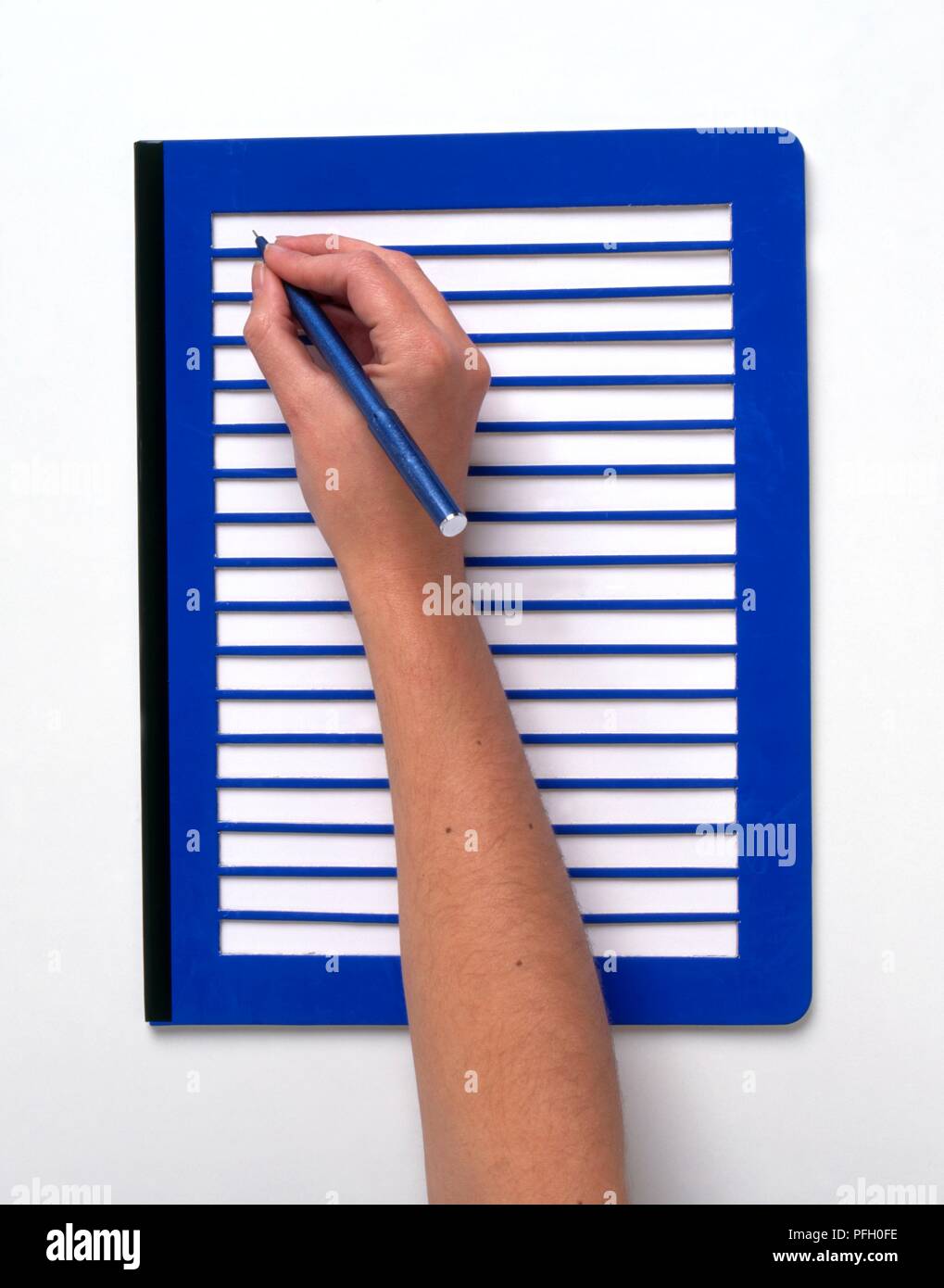 Using a writing frame as writing aid, closeup Stock Photo Alamy