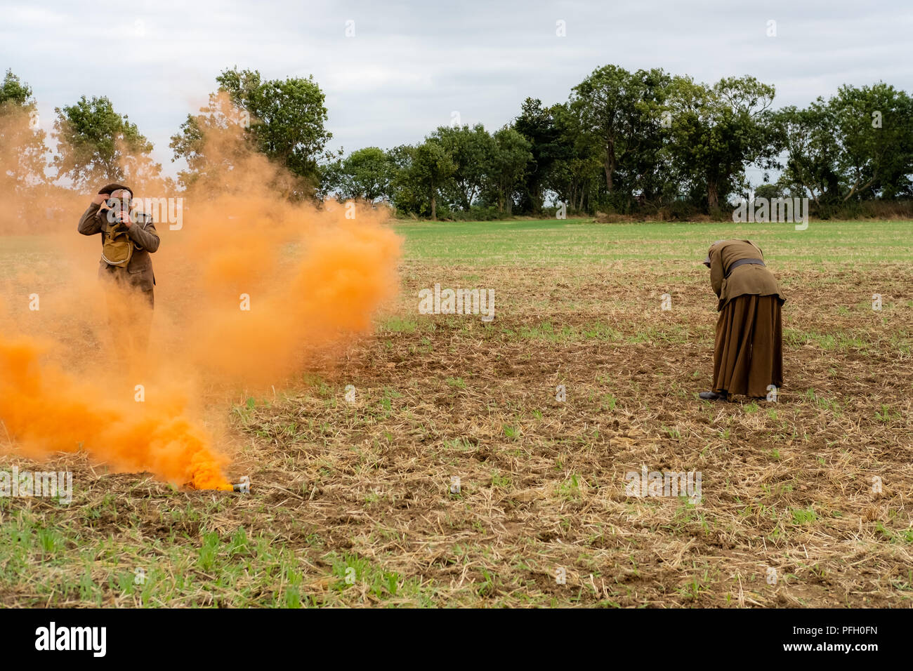 WW1 battle scene depicting a mustard gas attack on British troops, depicted by the orange smoke. Stock Photo