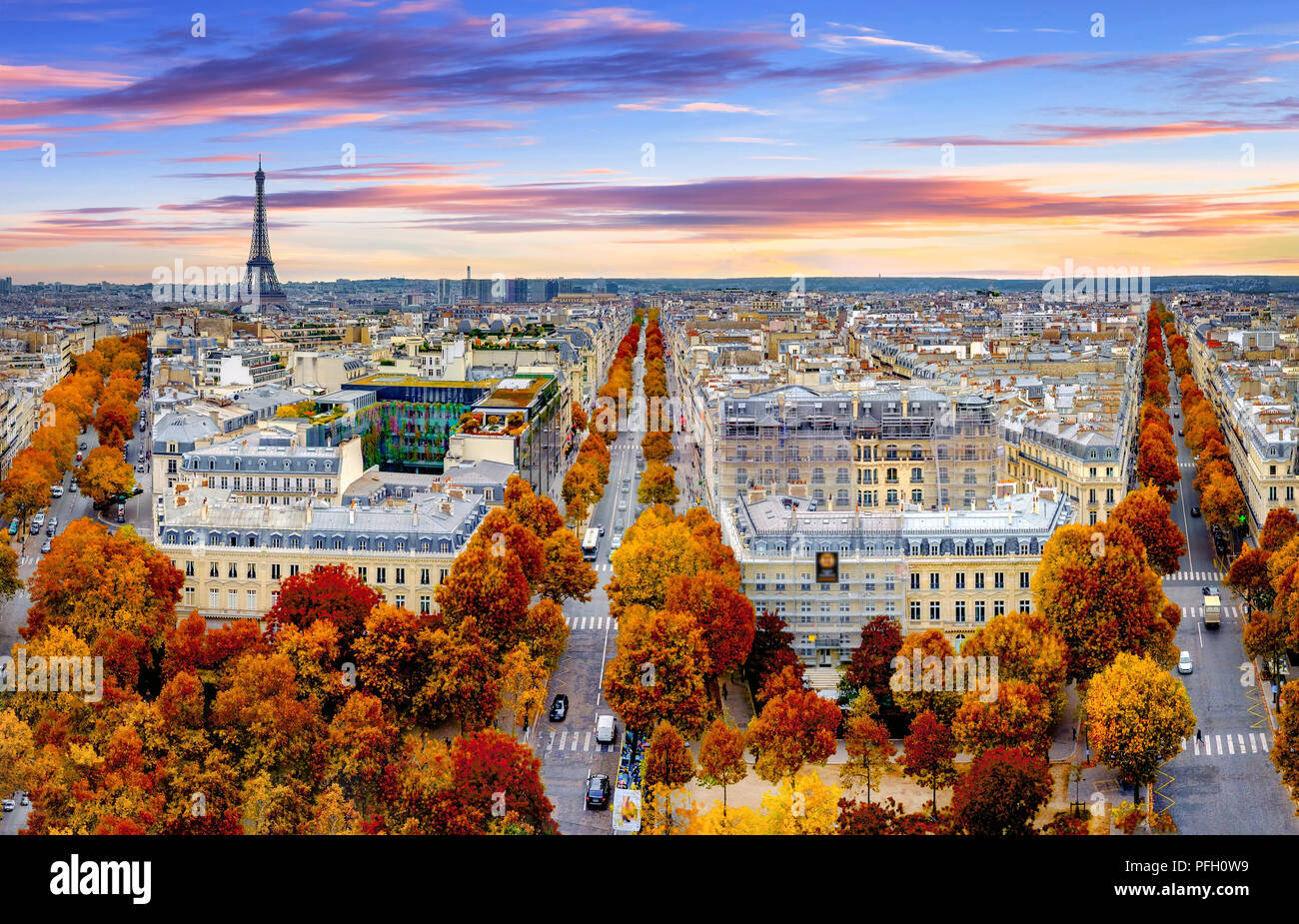 Aerial view of Paris in late autumn at sunset.Red and orange colored street trees. Eiffel Tower in the background. Paris, France Stock Photo