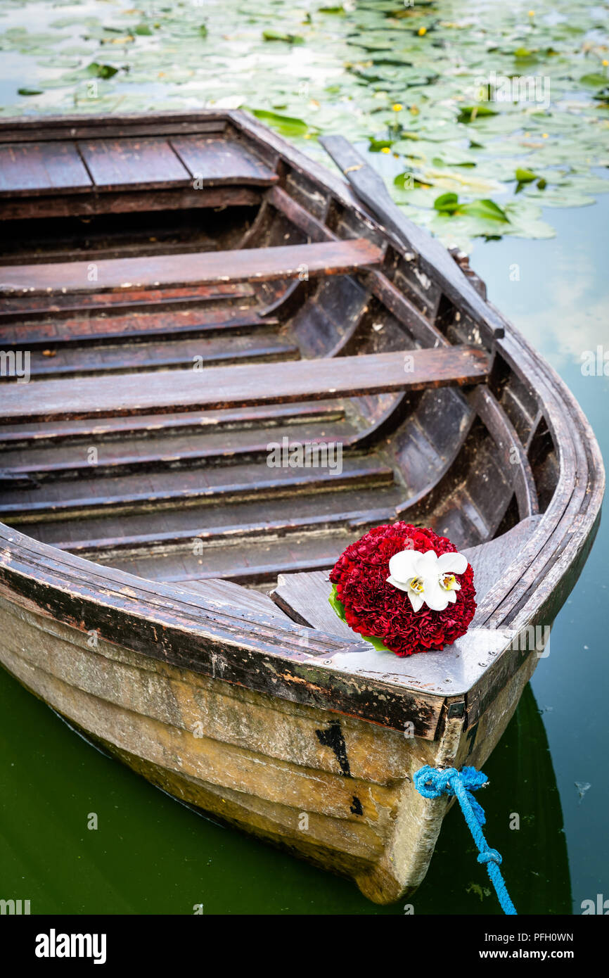 Wedding bouquet on wooden boat Stock Photo