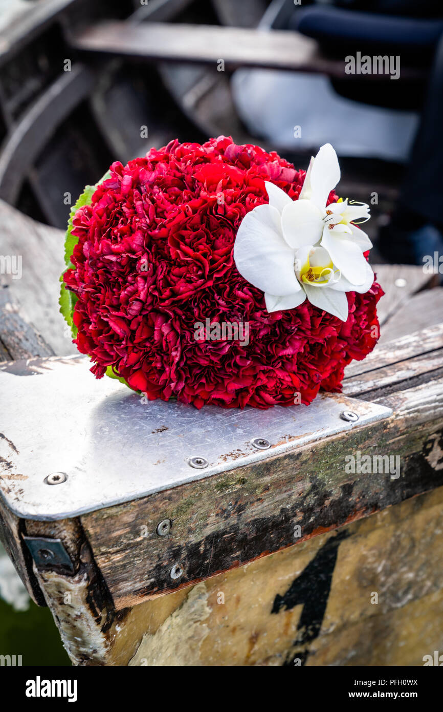 Wedding bouquet on wooden boat Stock Photo