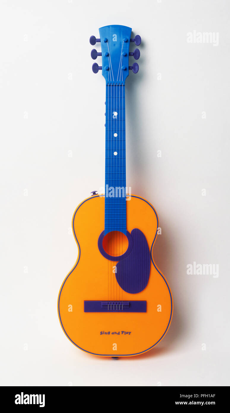 Toy guitar with blue handle Stock Photo Alamy
