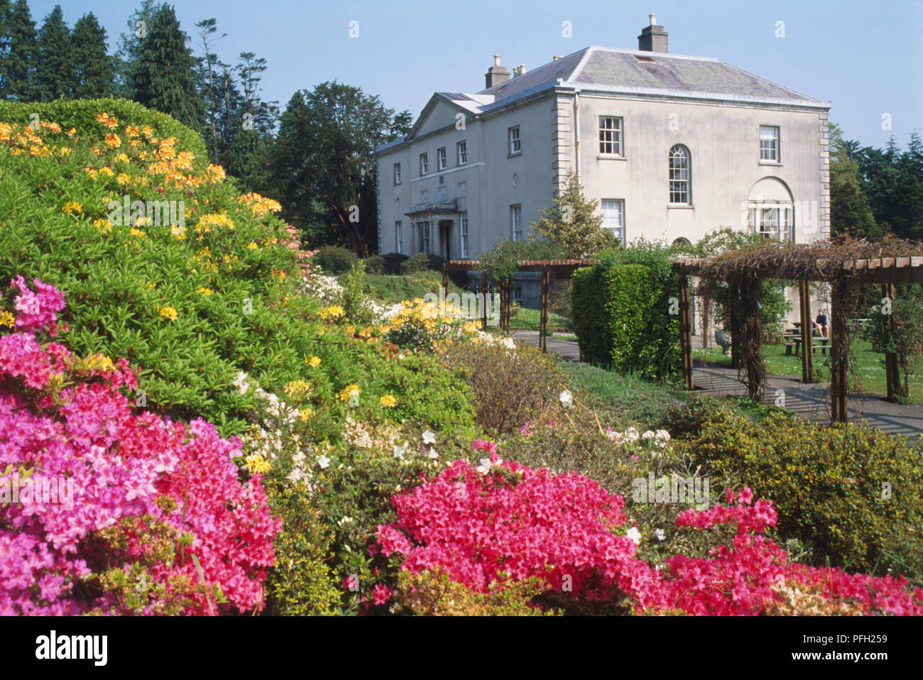 Ireland, Rathdrum, Avondale House with its colourful gardens in the foreground. Stock Photo