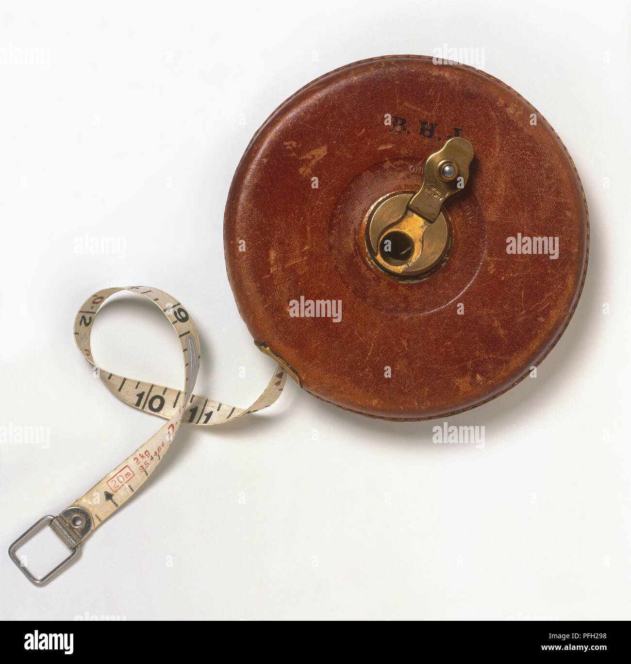 Tape measure in leather spool container Stock Photo Alamy