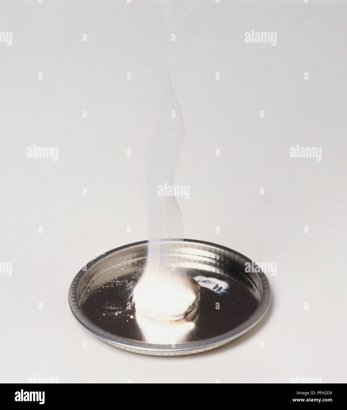 Exothermic burning reaction shown on a metal dish Stock Photo Alamy
