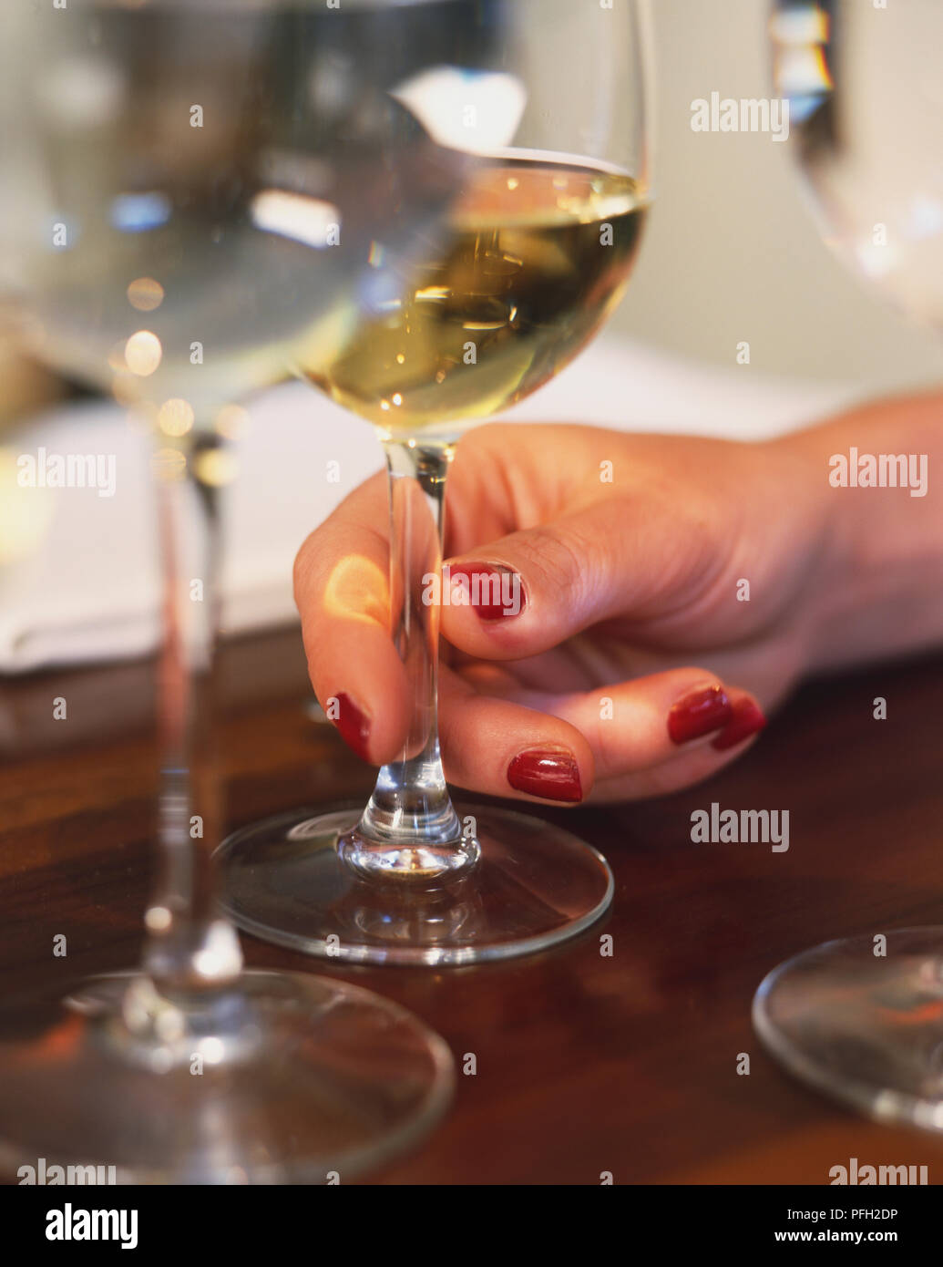 Woman's hand holding a wine glass, close up Stock Photo - Alamy