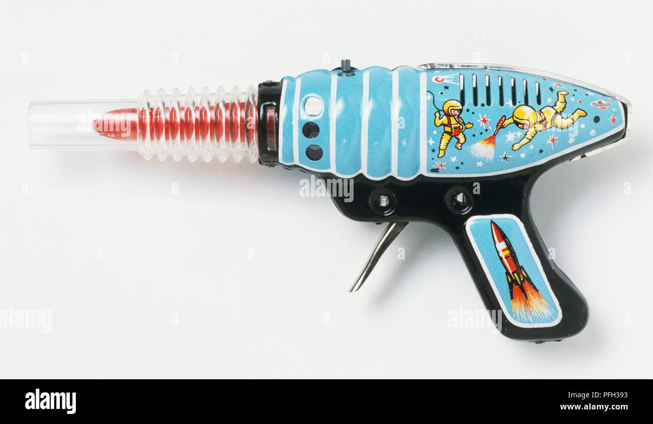 Toy Gun With Pictures Of Astronauts And Space Rocket Stock Photo Alamy