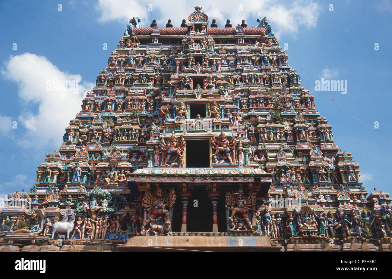 Hindu temple facade decorated with colourful statuettes Stock Photo