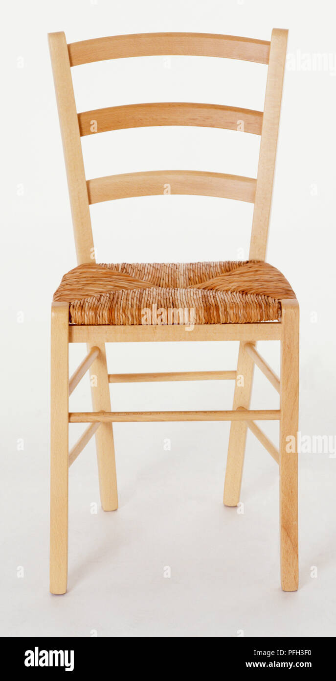 Wooden chair with straw seat, front view Stock Photo - Alamy