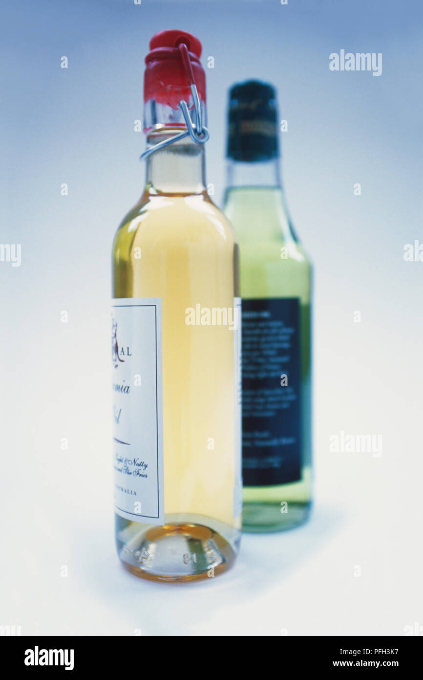 Download Two Bottles Filled With Light Green And Yellow Green Drinks One With Flip Top Stock Photo Alamy PSD Mockup Templates