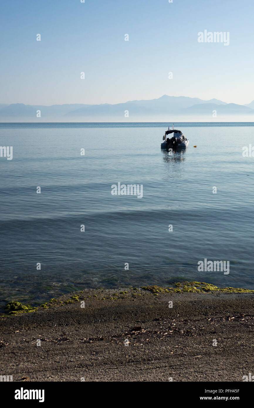 Dingy and shore from Corfu to Albania Stock Photo