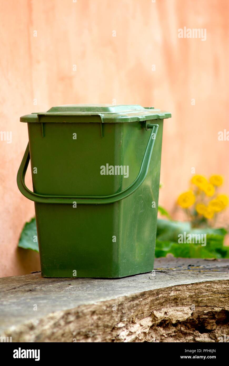 Green plastic bin for gardening waste Stock Photo Alamy