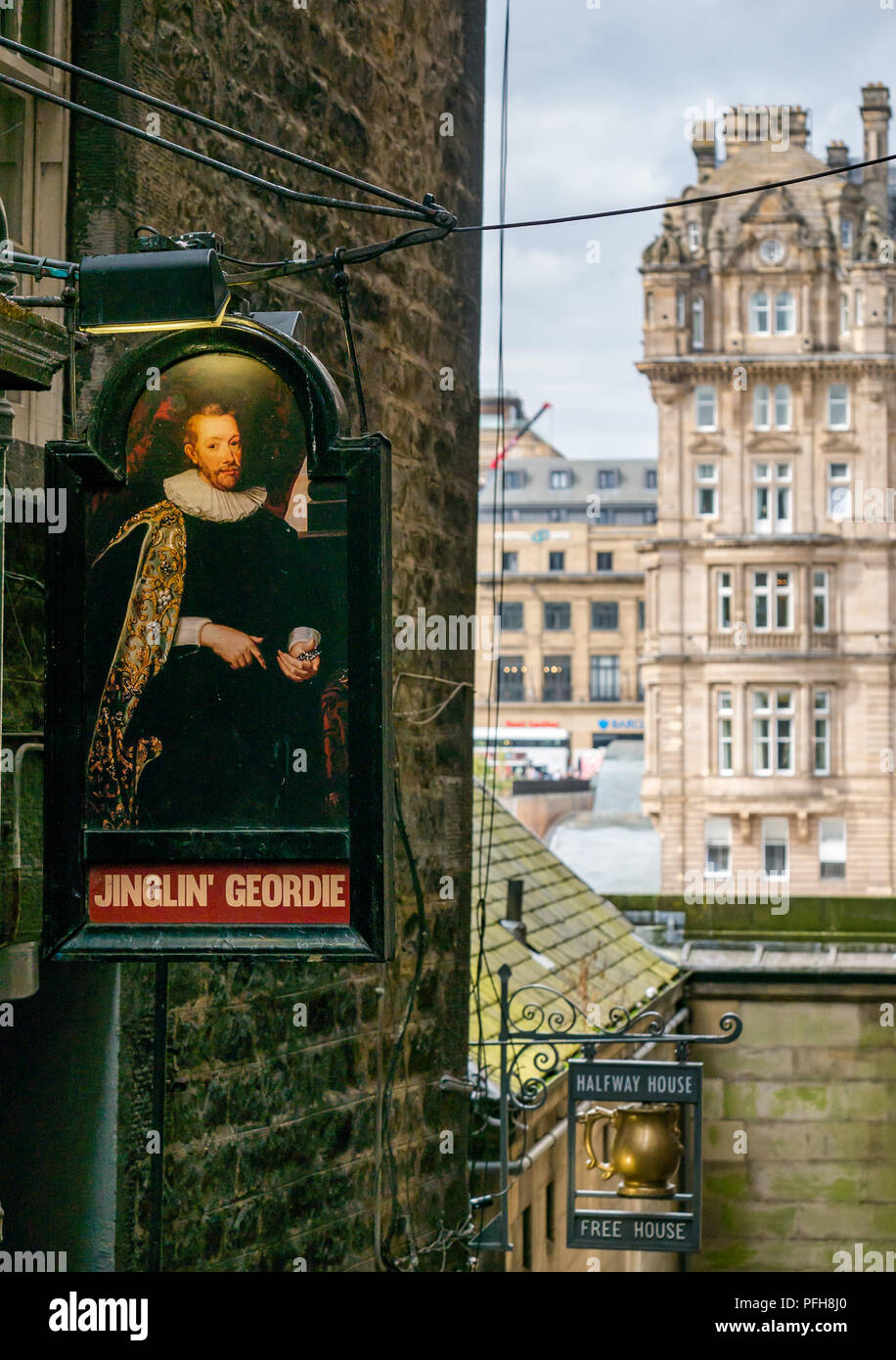 Pub signs for Jinglin Geordie and Halfway House pubs in alley, Fleshmarket Close, Edinburgh, Scotland, UK, with Rocco Forte Balmoral Hotel Stock Photo