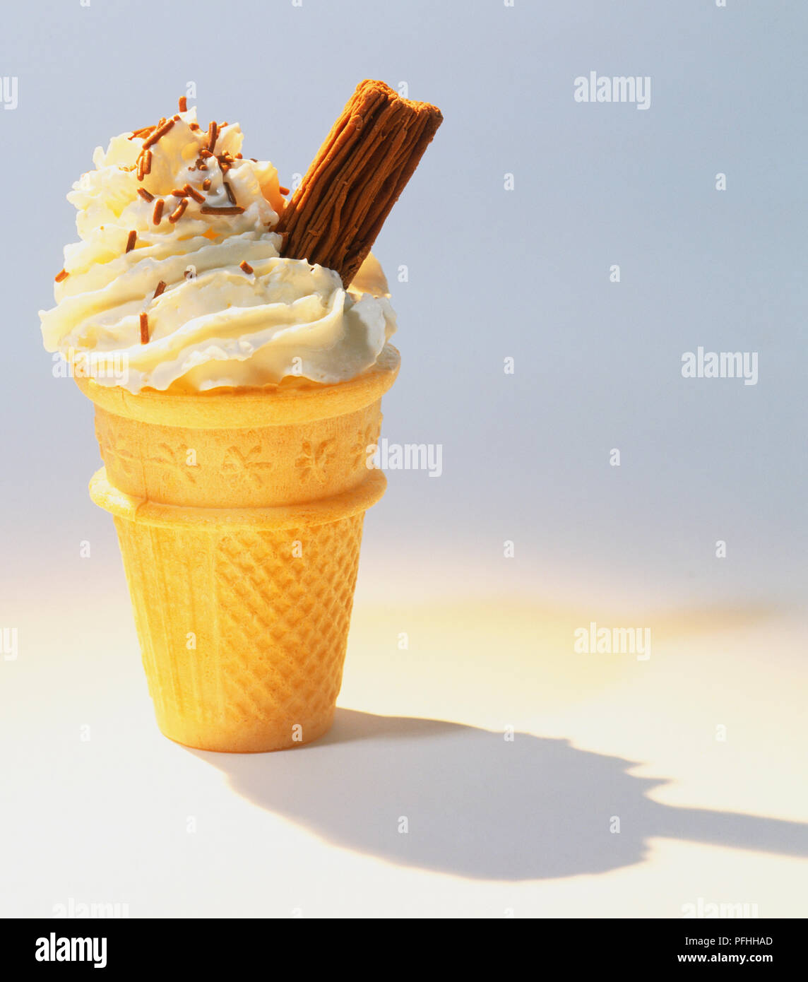 Flatbased ice cream cone with piped ice cream and a chocolate flake