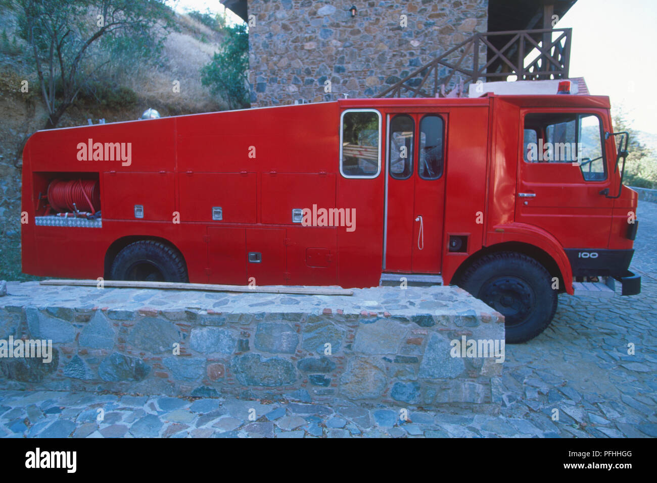 Cyprus, red fire engine parked by side of building Stock Photo