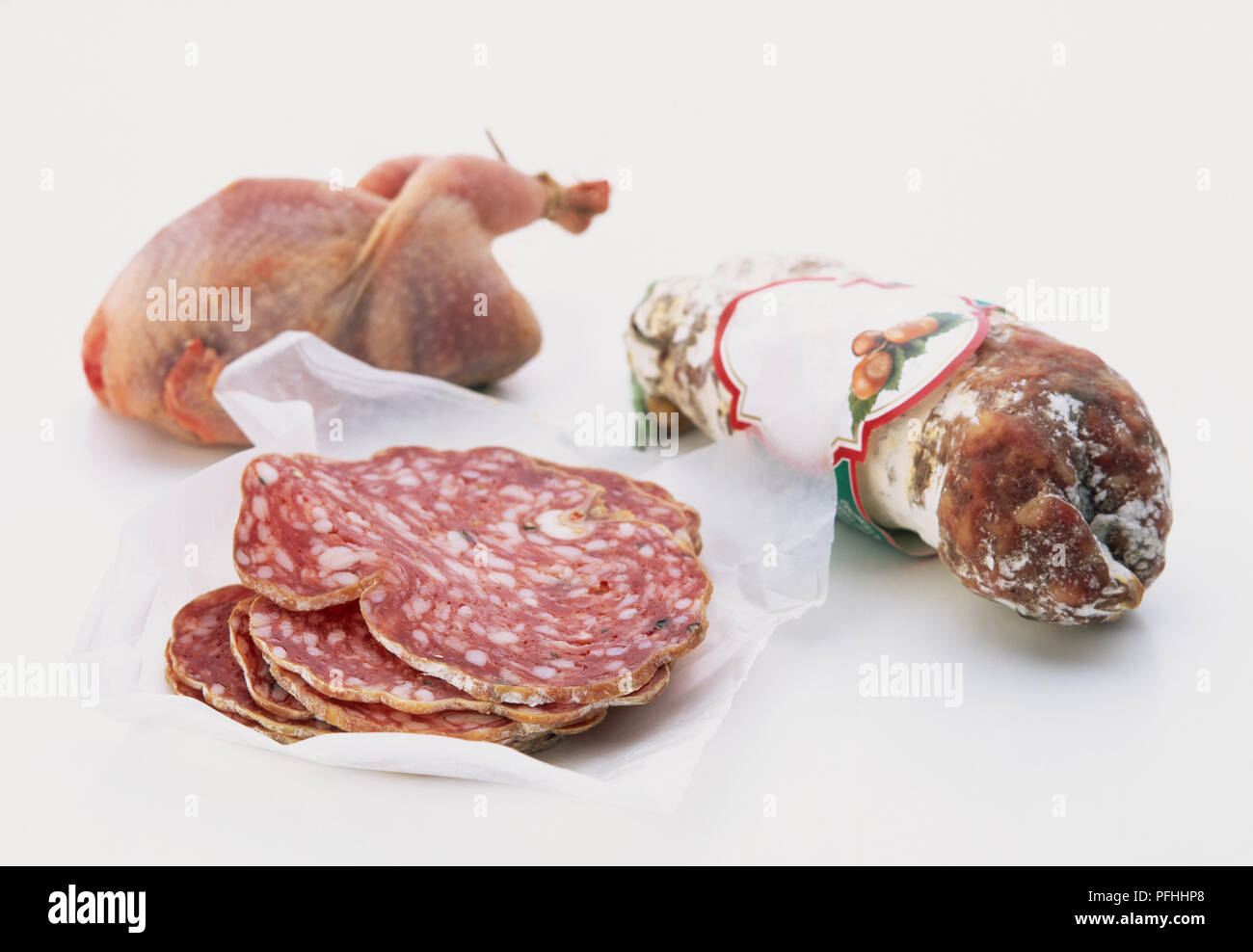 France, sliced meat, whole raw chicken and packaged saucisson Stock