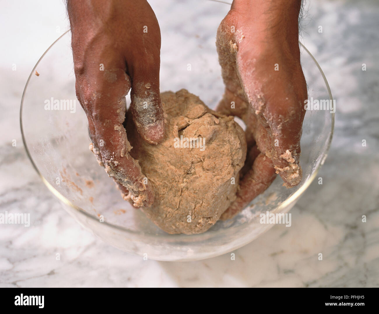 Kneading Chapati bread dough in a glass bowl Stock Photo Alamy