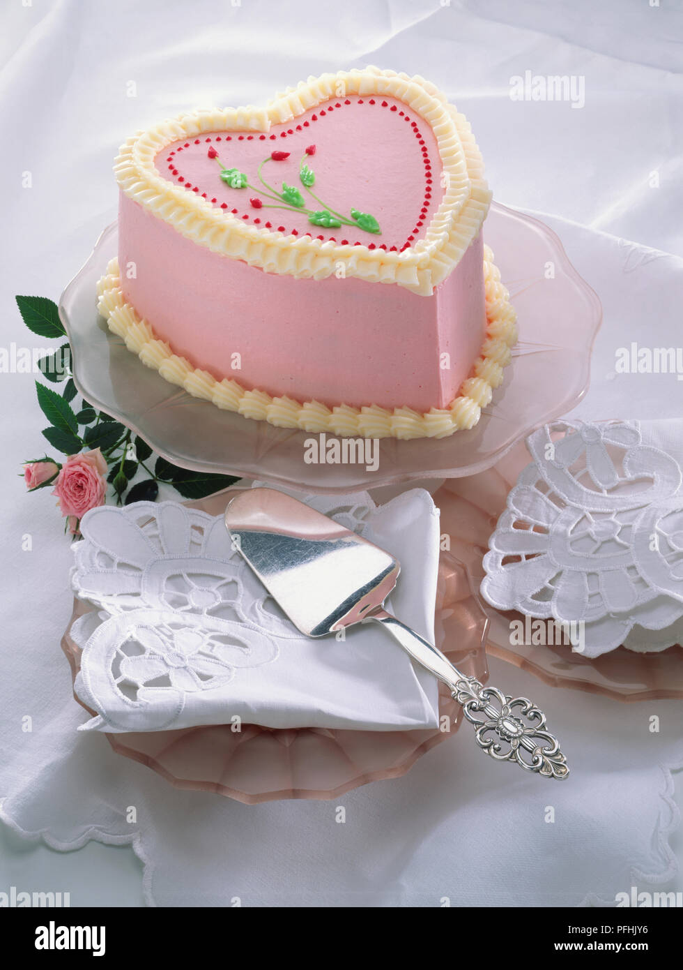 Heart Shaped Cake Decorated With Pink Icing And Frosting