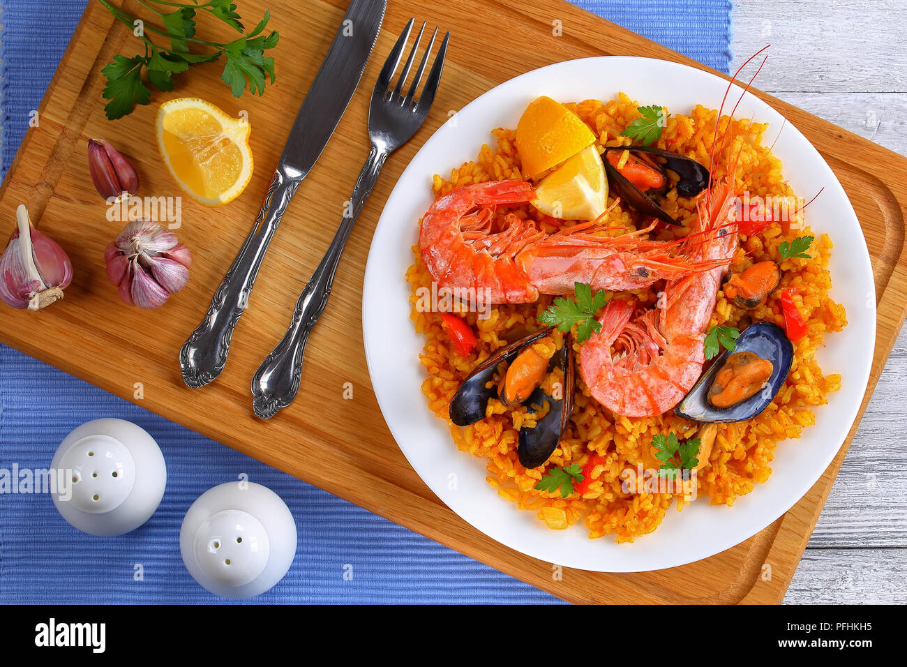 portion of gourmet seafood valencia paella with king prawns, mussels on