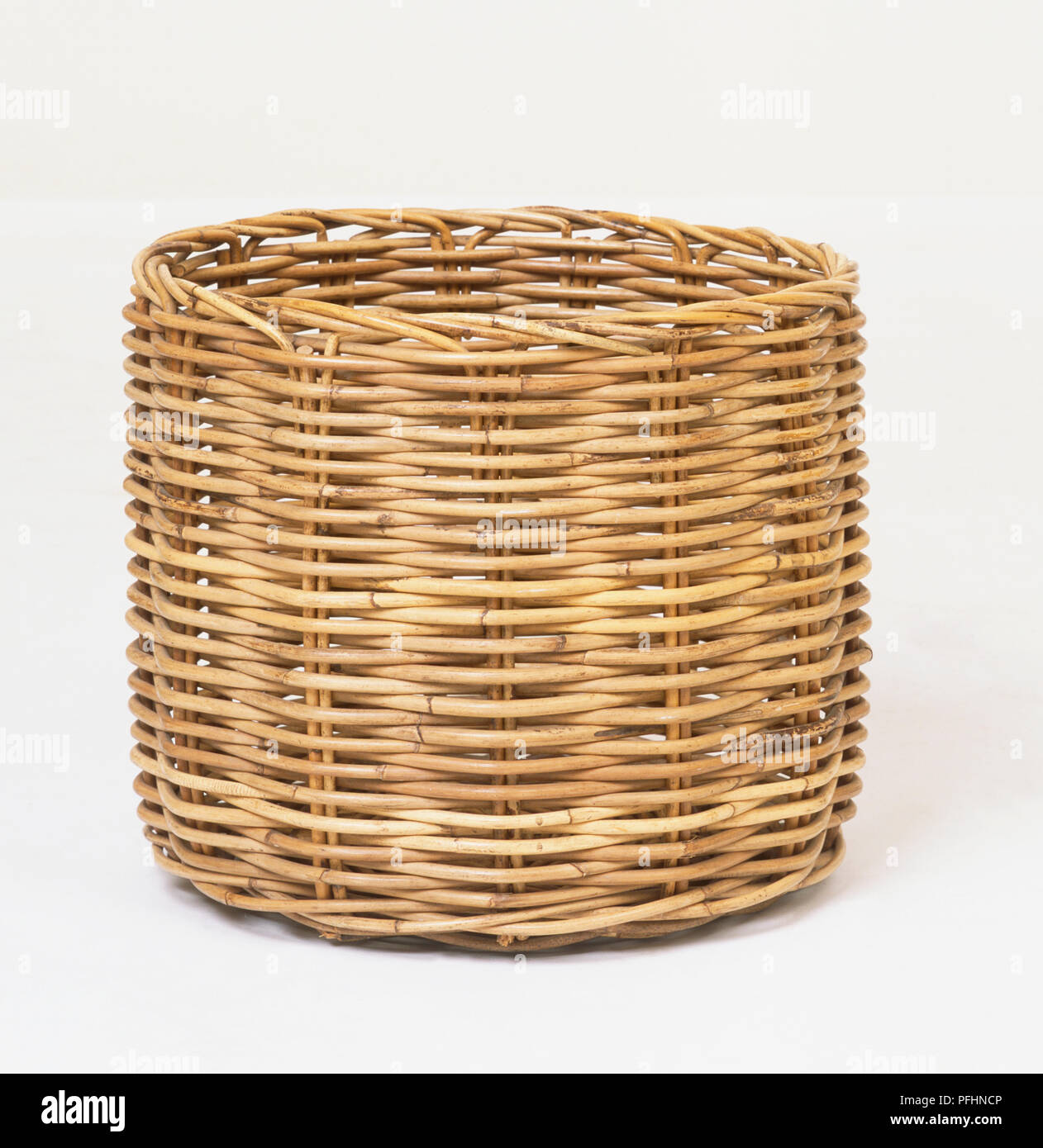 Cylindrical wicker basket, close up. Stock Photo