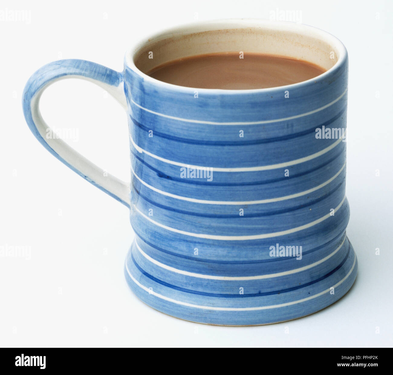 A blue and white striped mug filled with hot chocolate Stock Photo