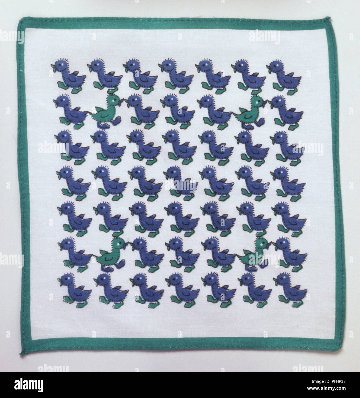 Green edged handkerchief, with rows of blue and green ducks at the centre Stock Photo