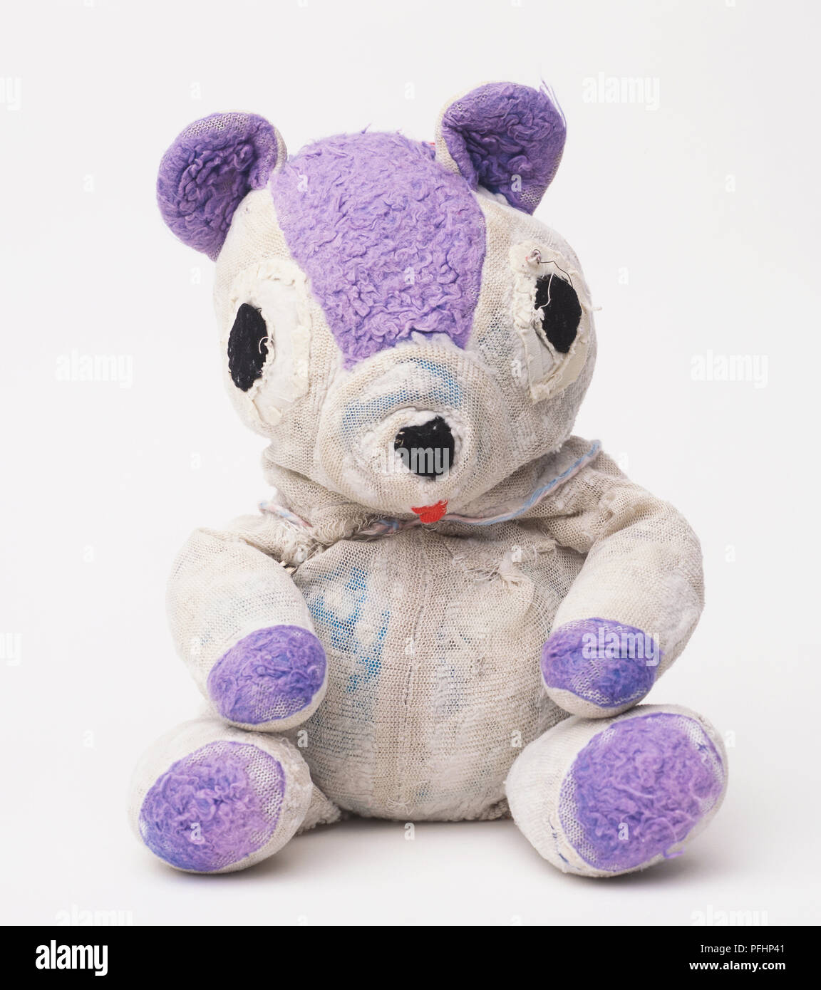 A purple and white soft toy Stock Photo - Alamy