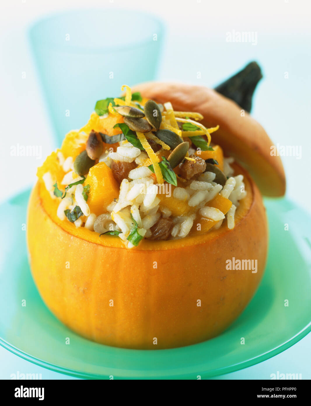 Pumpkin risotto stuffed into small pumpkin, close up. Stock Photo