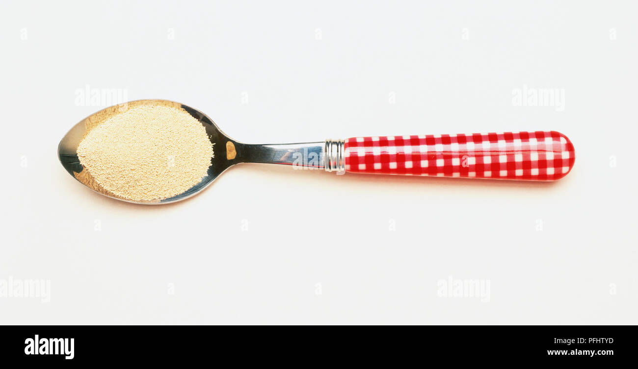Dried yeast on teaspoon Stock Photo Alamy