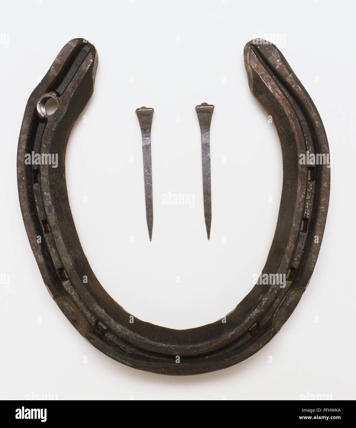 Metal horseshoe and nails, close up Stock Photo Alamy
