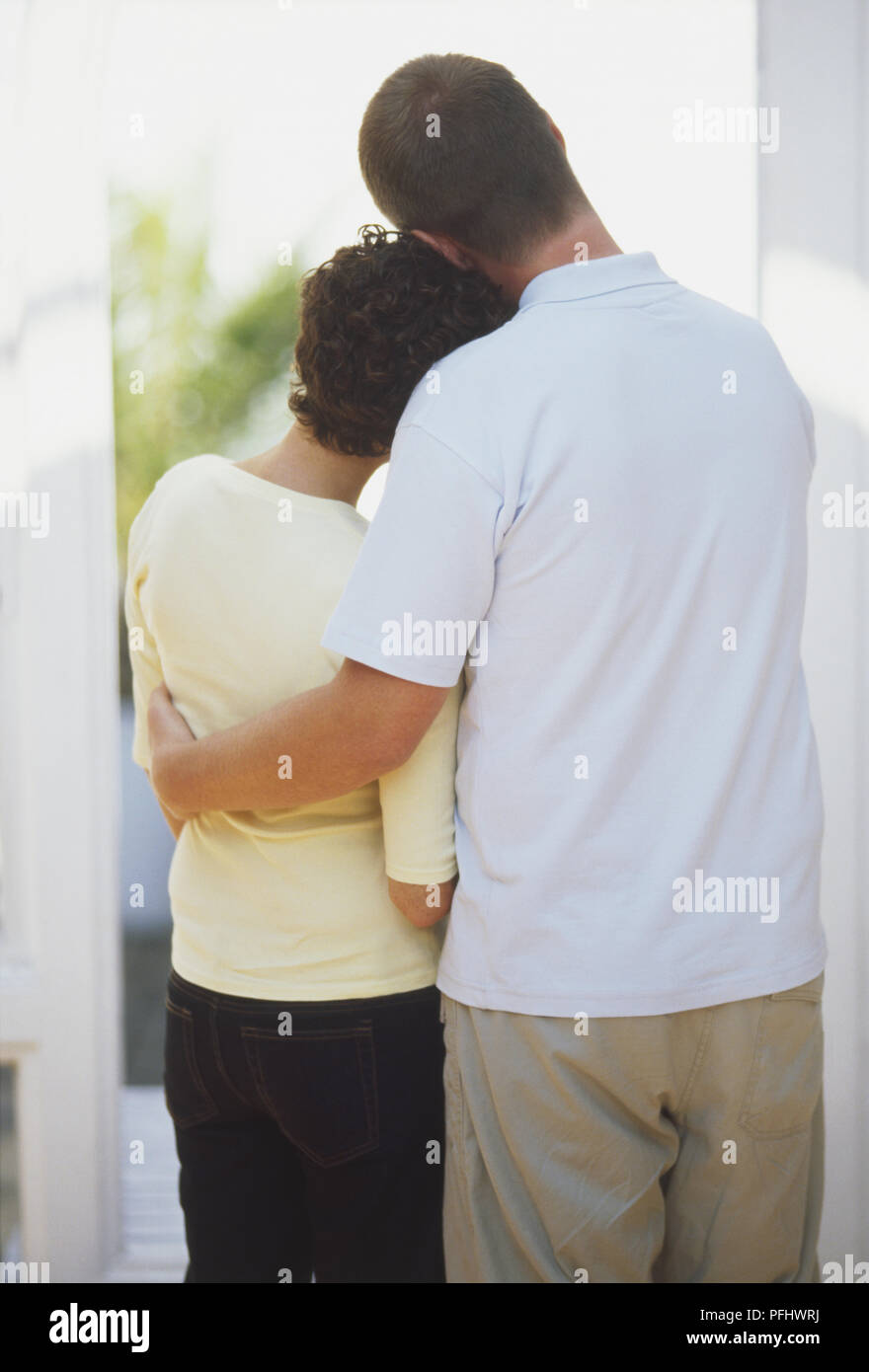 Man comforting woman rear view hi-res stock photography and images - Alamy