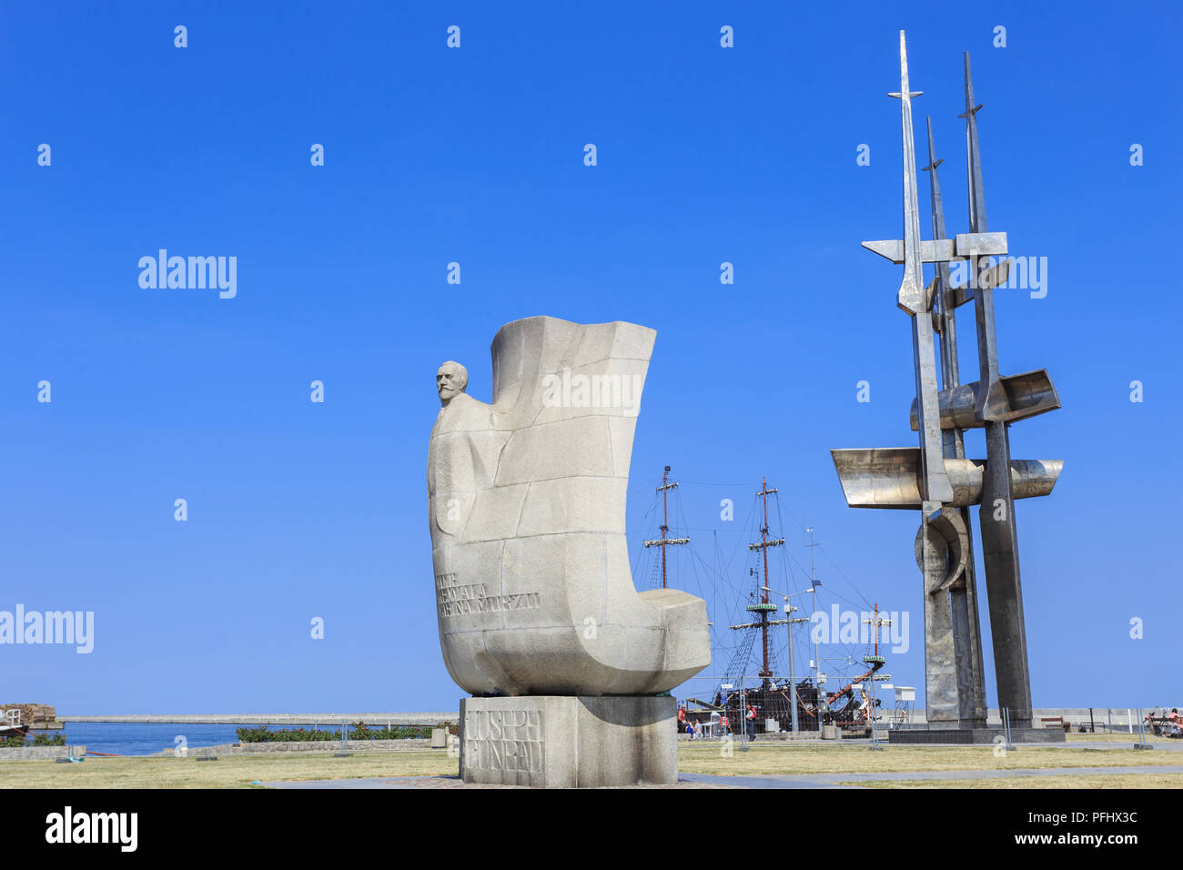 Gdynia - Two monuments located on South Pier. Monument to Polish writer Joseph Conrad and monument 'Game of Masts' Stock Photo