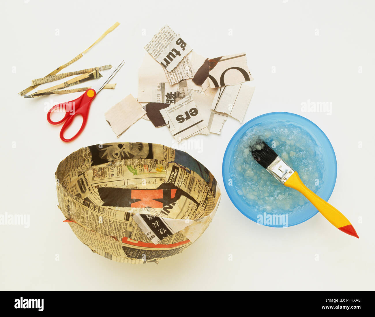 Papier Mache equipment, strips of newspaper, scissors, brush 'pasting