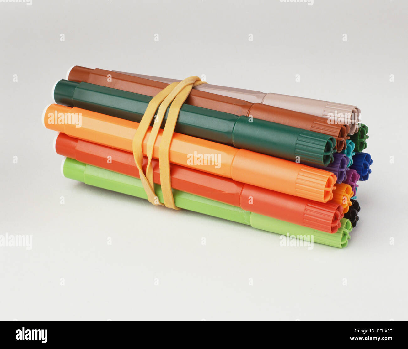 Coloured felt-tip pens bound together with rubber band, close up Stock  Photo - Alamy