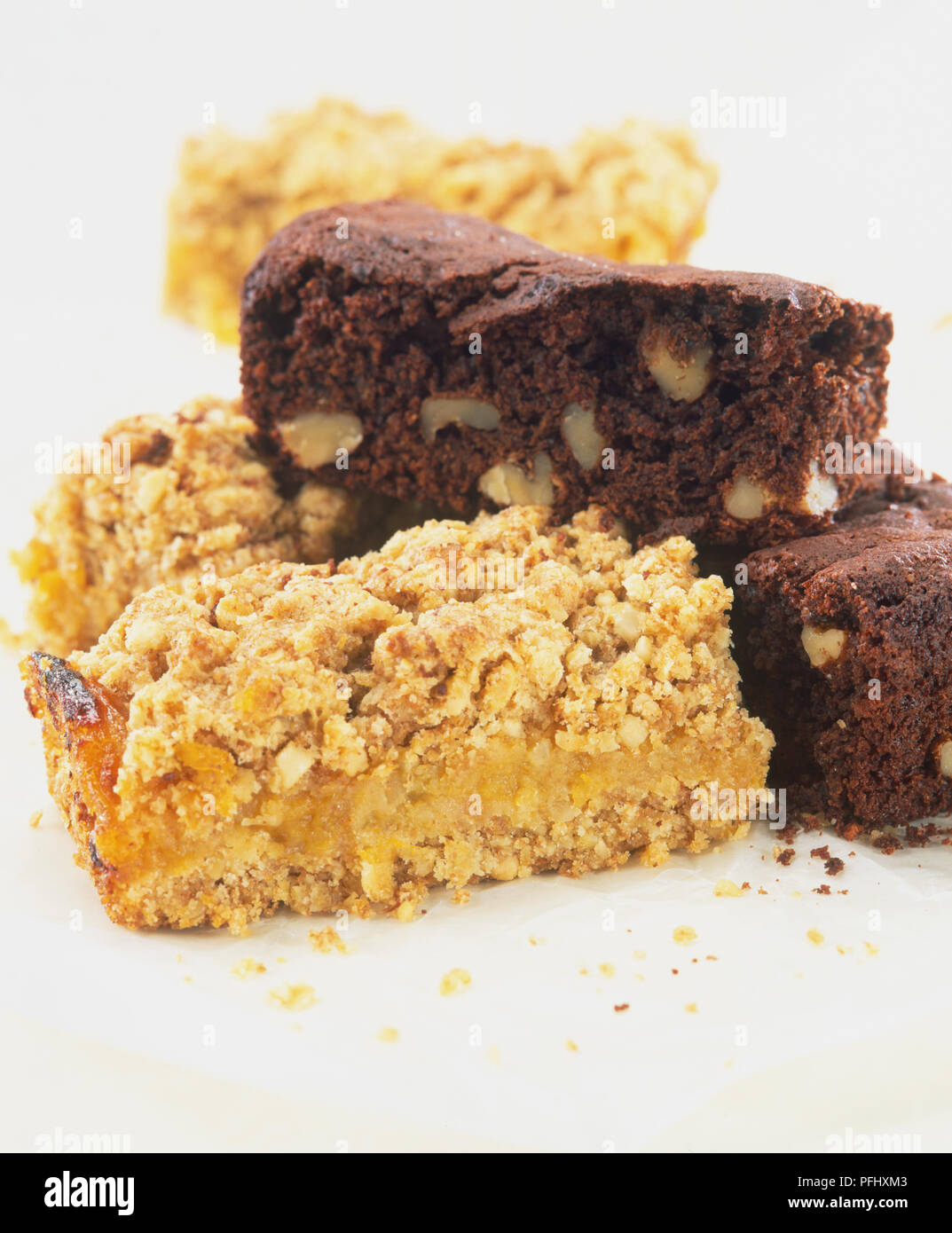Slices of chocolate cake and fruit crumble, close up Stock Photo Alamy