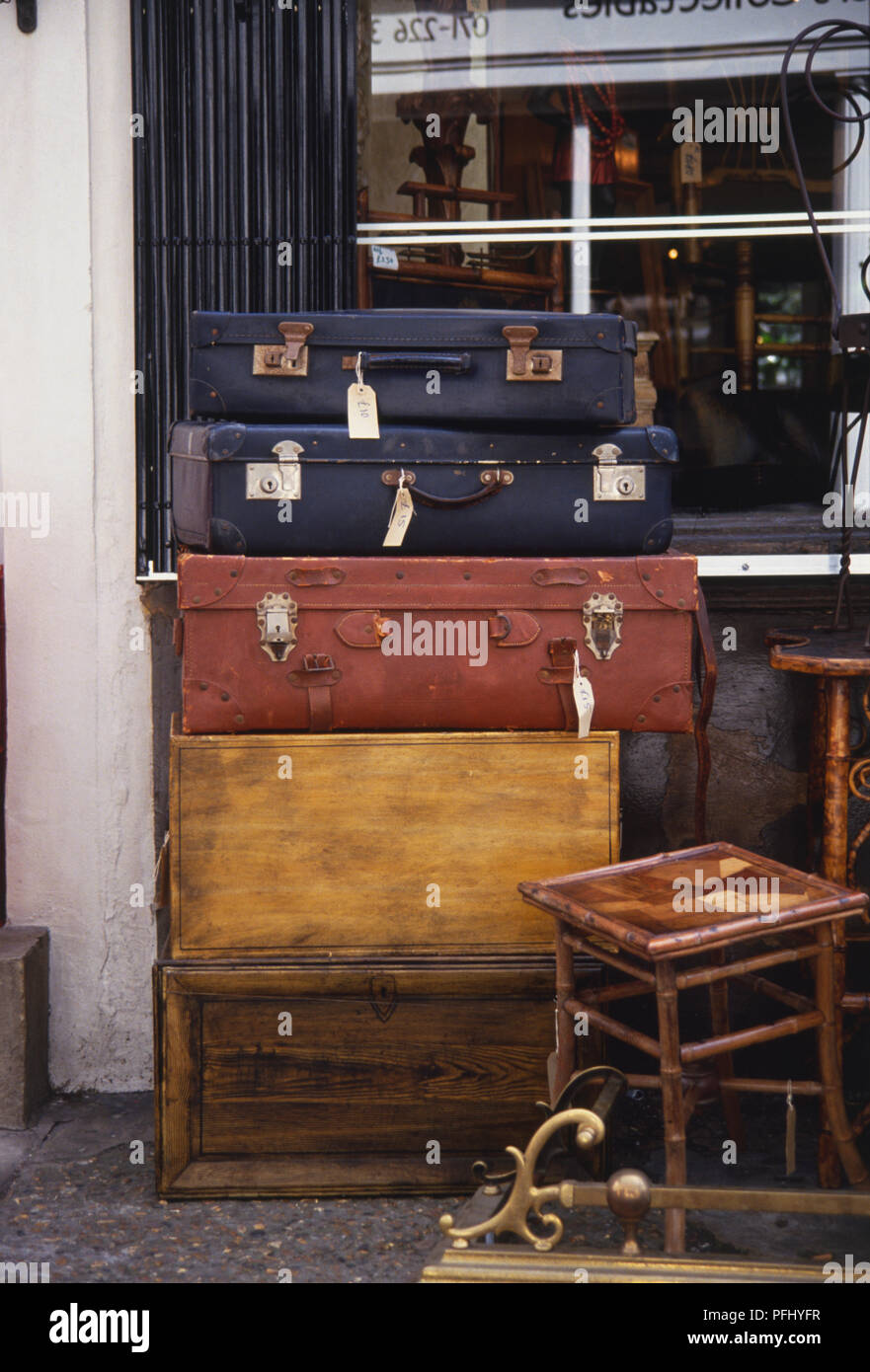 England, London, Camden Town, suitcases stacked outside an antique shop