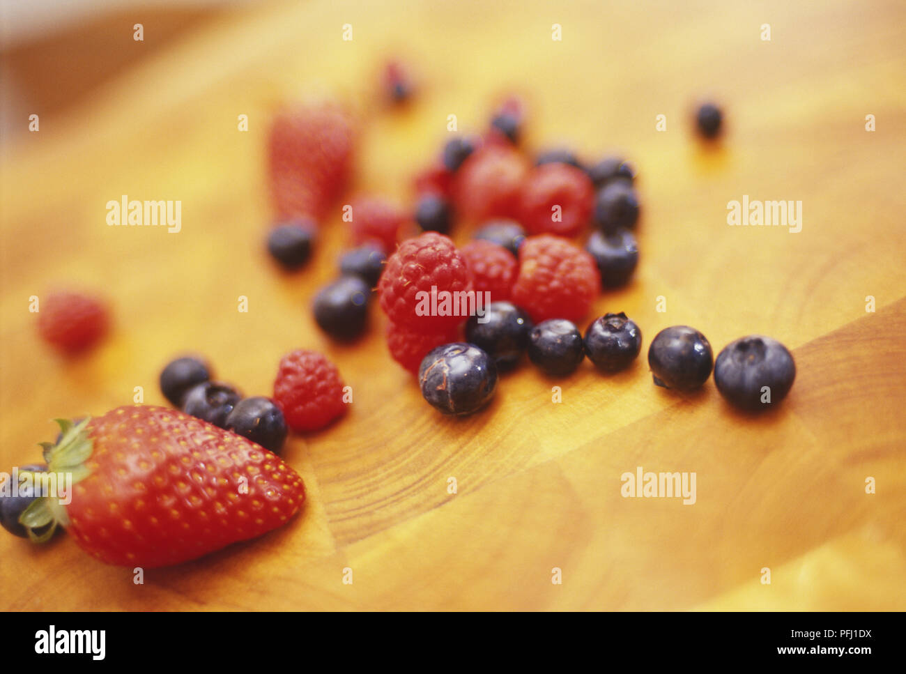 Summer berries on wooden countertop Stock Photo
