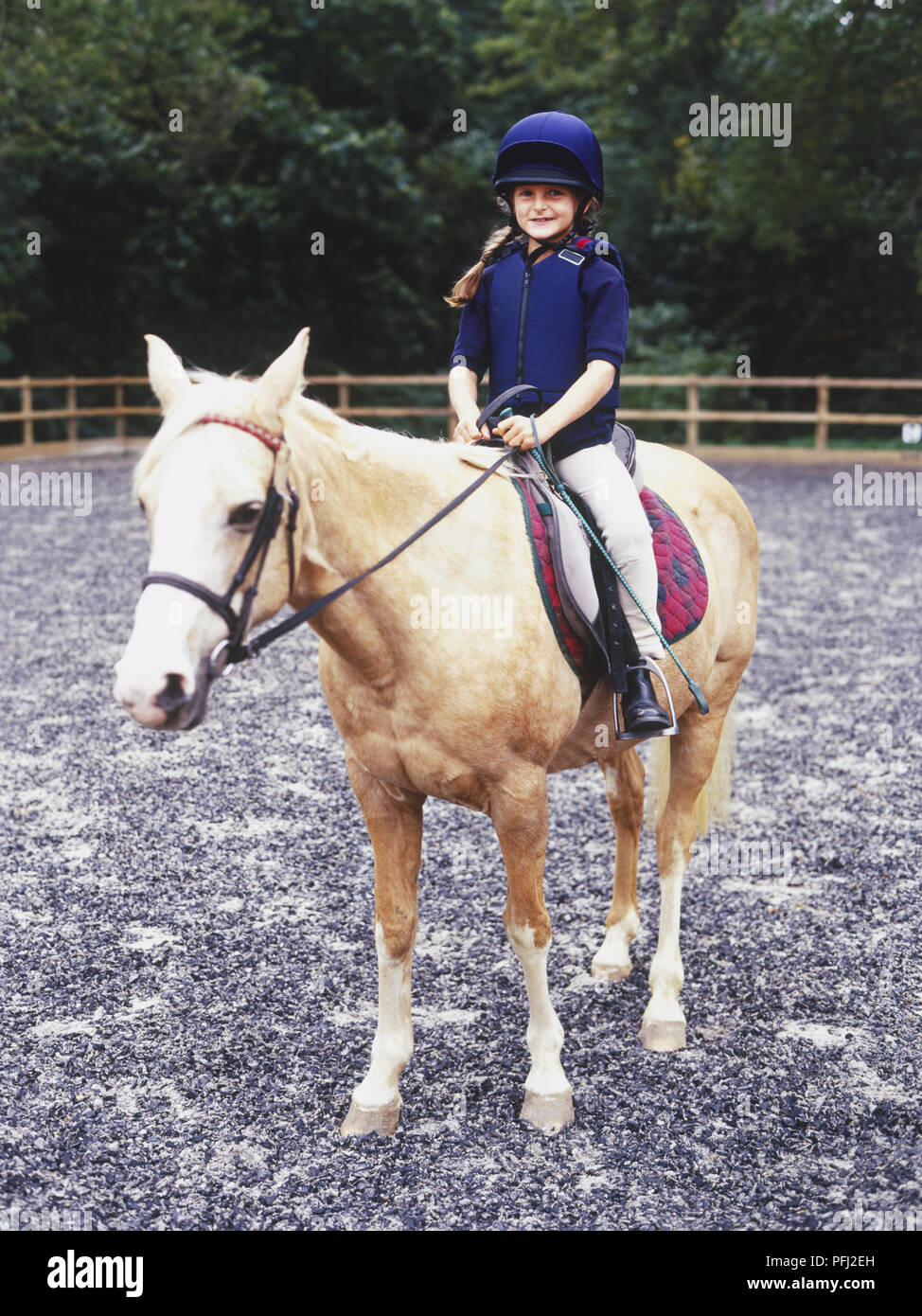 Girl sitting in saddle hi-res stock photography and images - Alamy