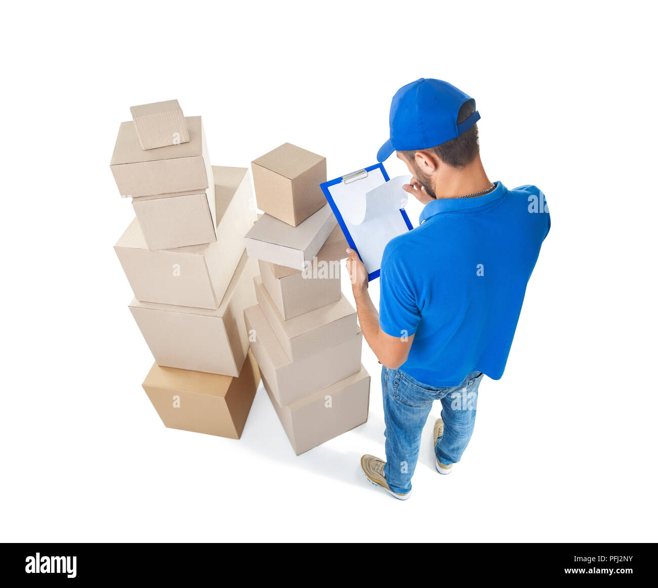 Top view of delivery man taking notes near stack of parcels boxes ...