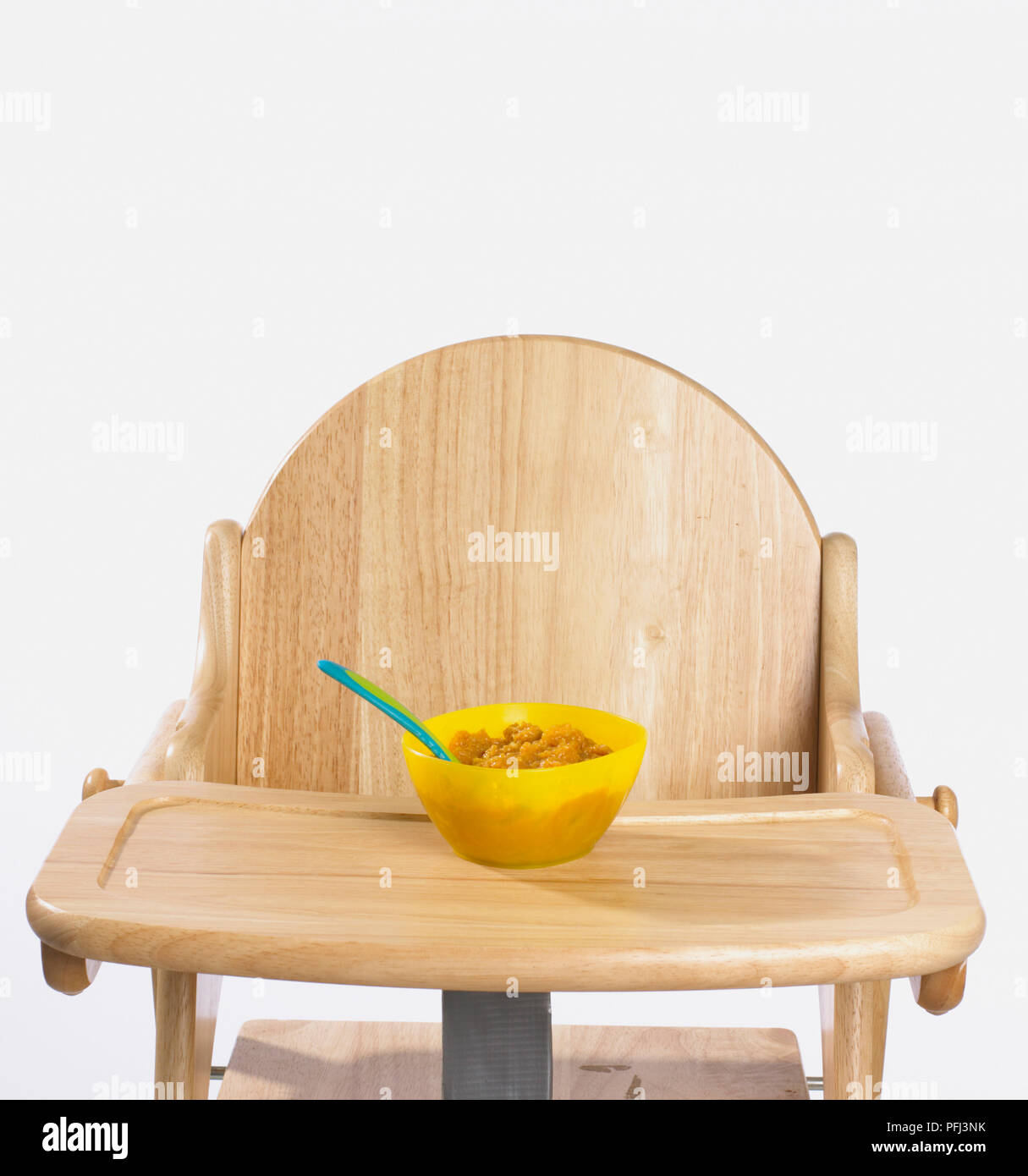 Download Baby Food And Spoon In Yellow Plastic Bowl On Wooden High Chair Stock Photo Alamy Yellowimages Mockups