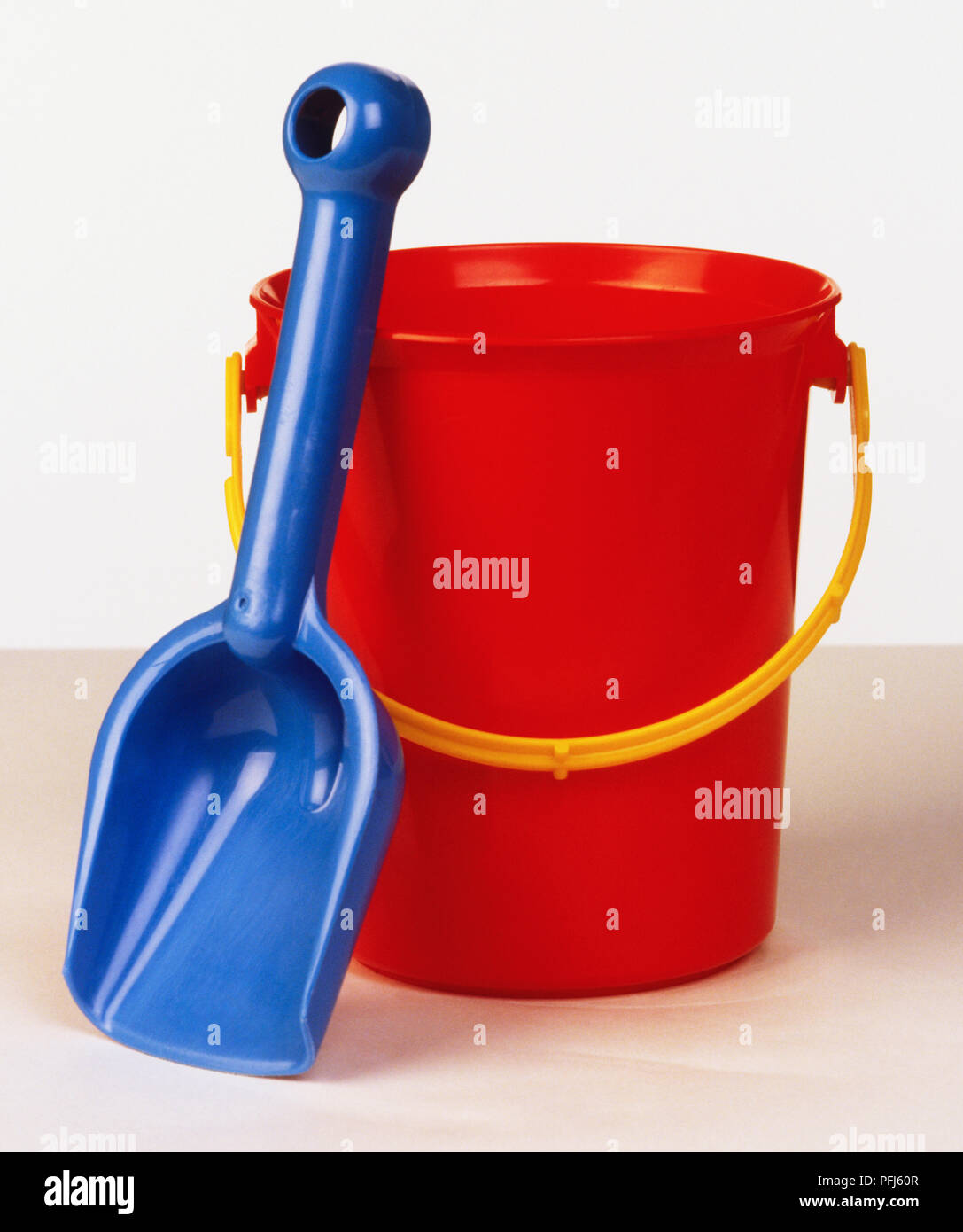 Red bucket and blue spade Stock Photo Alamy