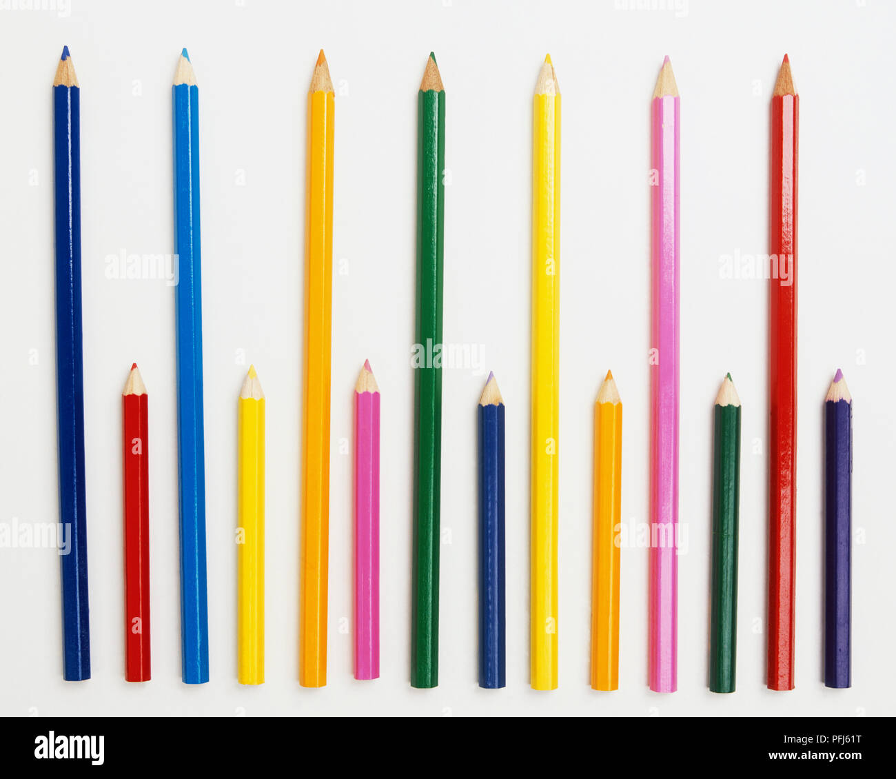 Array of small and large coloured pencils Stock Photo