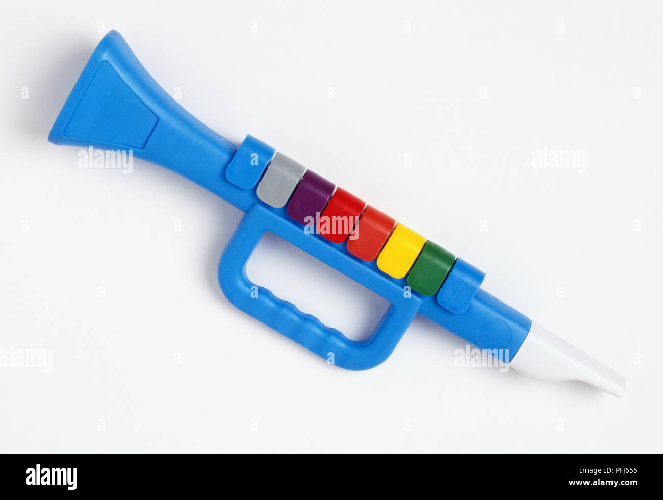Plastic toy clarinet with multi-coloured keys Stock Photo