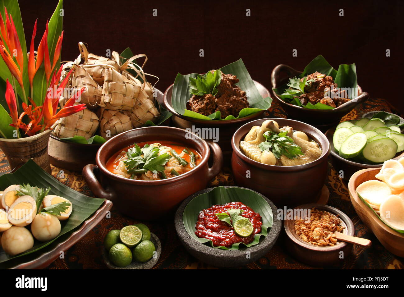 Ketupat Lebaran, the traditional celebratory dish of rice cake with several side dishes; popular during Eid celebrations. Stock Photo