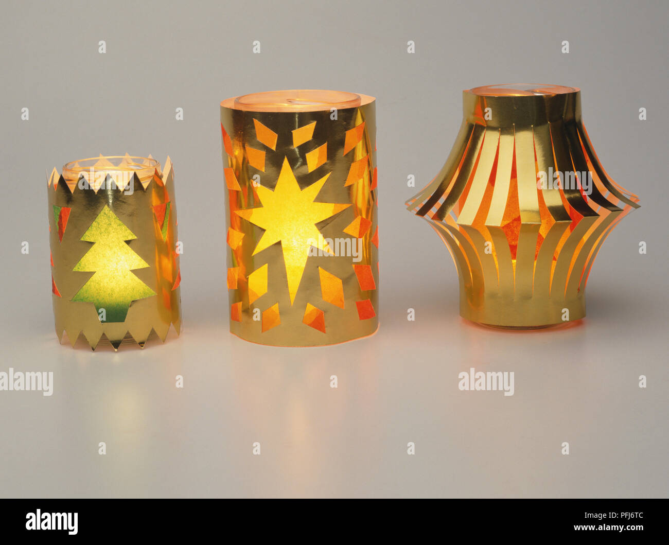 Three paper lanterns, christmas tree, star and concertina design, front view. Stock Photo